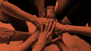 multiple hands on top of another