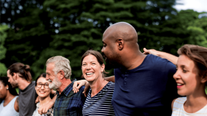 Diverse, smiling group standing in a line