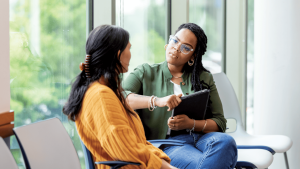 Two women sitting in a counseling session