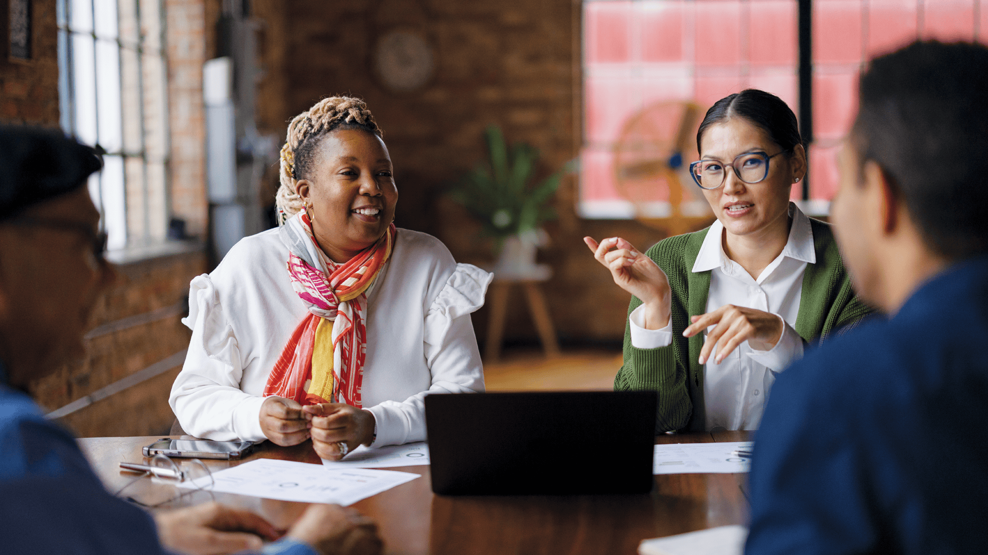 Diverse group in discussion at a table